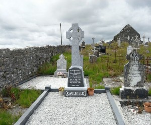 Limestone celtic cross with new granite panal, granite kerbs and 4 posts